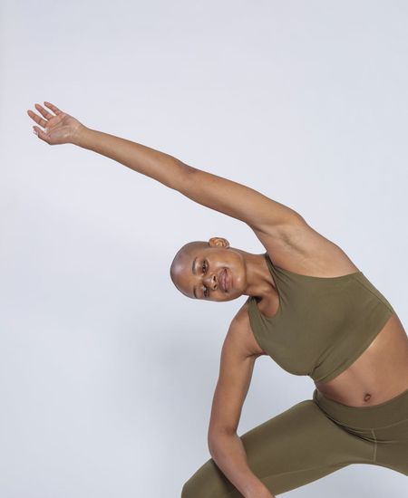 Woman in a calm yoga pose, embodying physical harmony and balance.